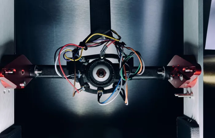 Close-up view of a smart wearable device prototype with exposed wires and components